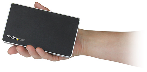 The DVI docking station is about the size of one's hand, the image highlights the dock's compact and palm-sized design