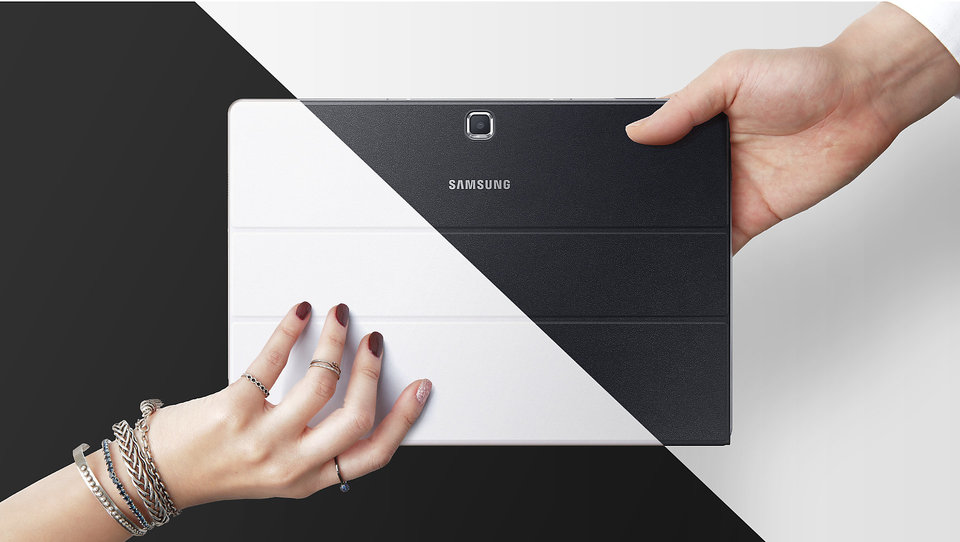 Galaxy TabPro S white held by a woman’s hand, black by a man’s hand
