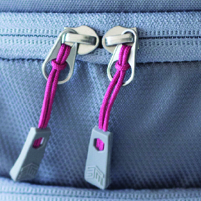 To show one’s teeth is a demonstration of strength or power. But in the case of our reverse coil zippers, not showing the teeth is what makes this closure so tough. We position the slider on the flatter side and feature a fabric covering over the teeth to help keep out dirt and moisture. Reverse Coil Zippers Banner