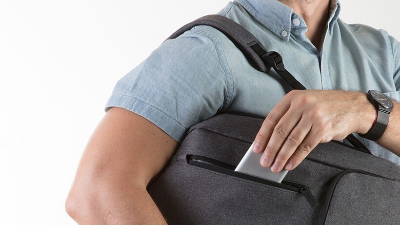 Compact size and sturdy construction Man putting the Belkin USB-Câ„¢ Multimedia Hub into his bag